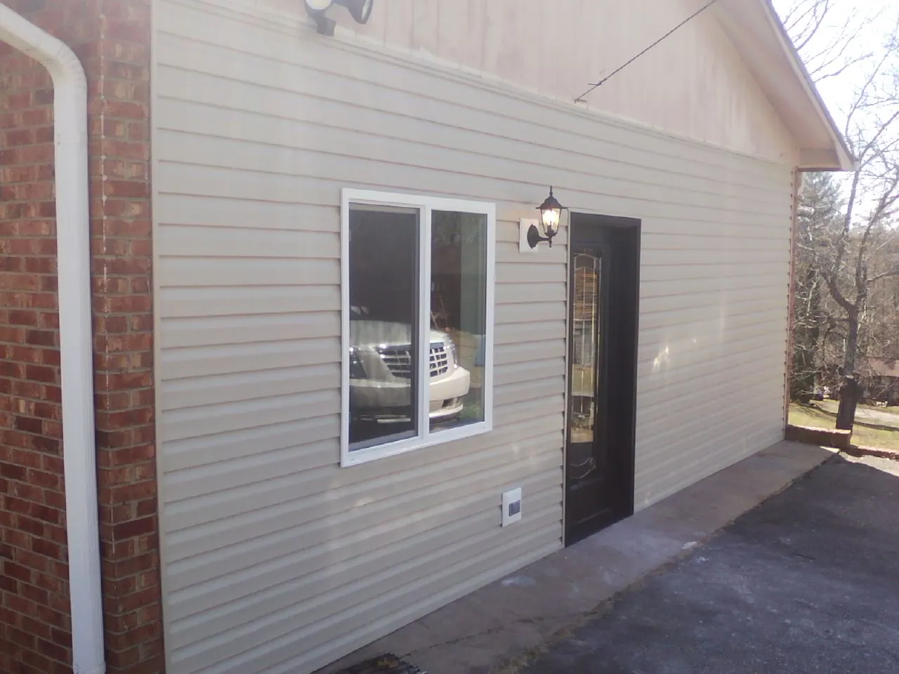 New vinyl siding and entry door on a room addition in Neah Bay
